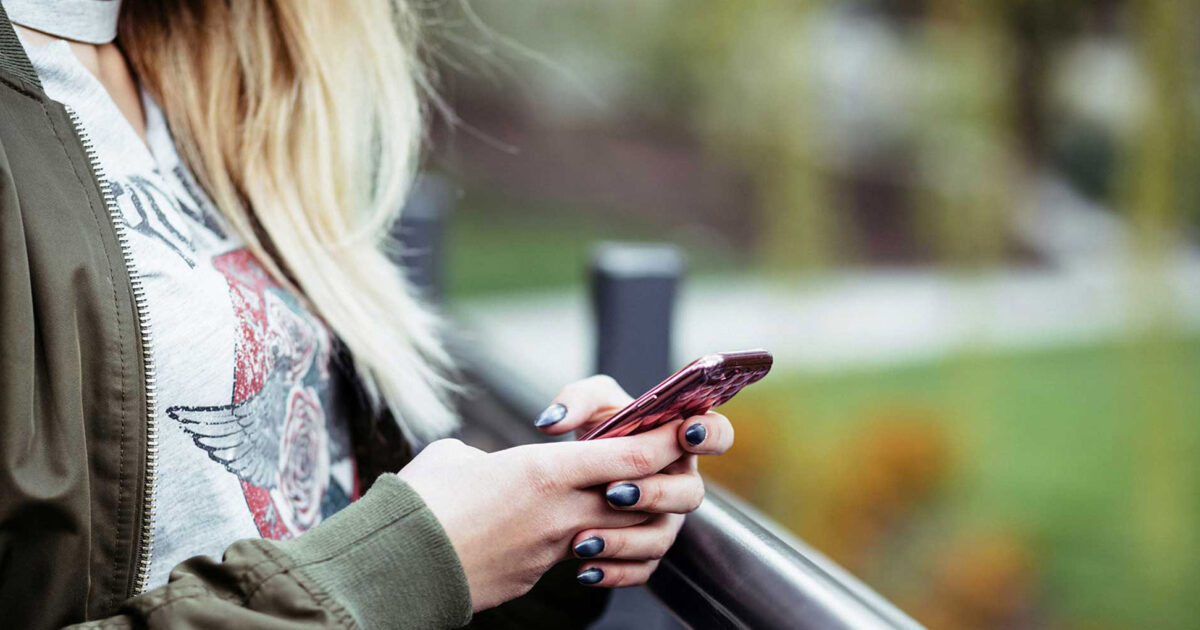 Person using a smartphone app outdoors