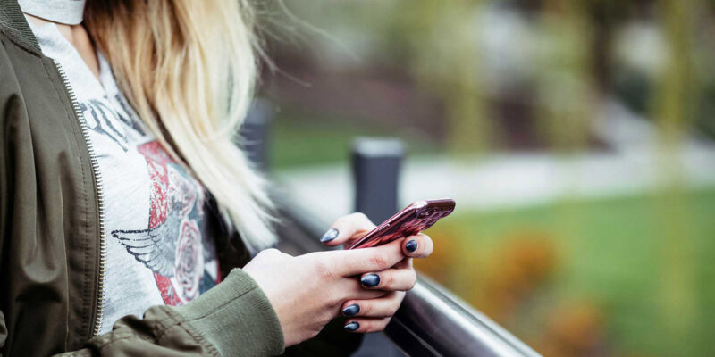 Person using a smartphone app outdoors