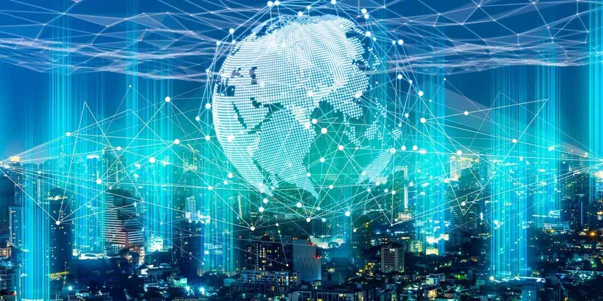 Glowing digital globe with network connections over a city skyline at night