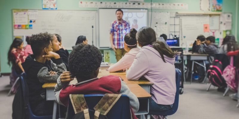 Teacher instructing students in a classroom