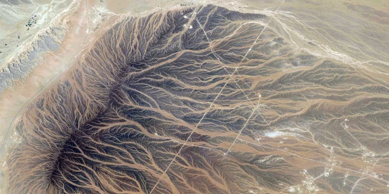 Aerial view of eroded desert canyon terrain