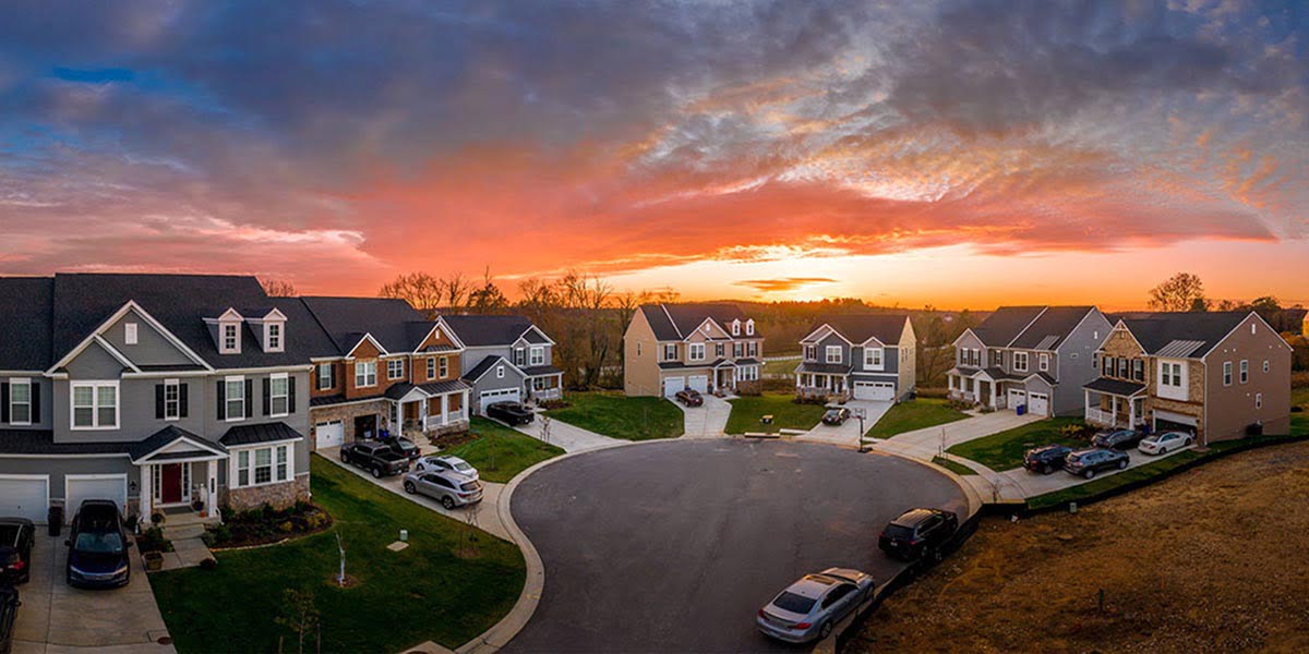 Aerial view of a suburban housing development at sunset