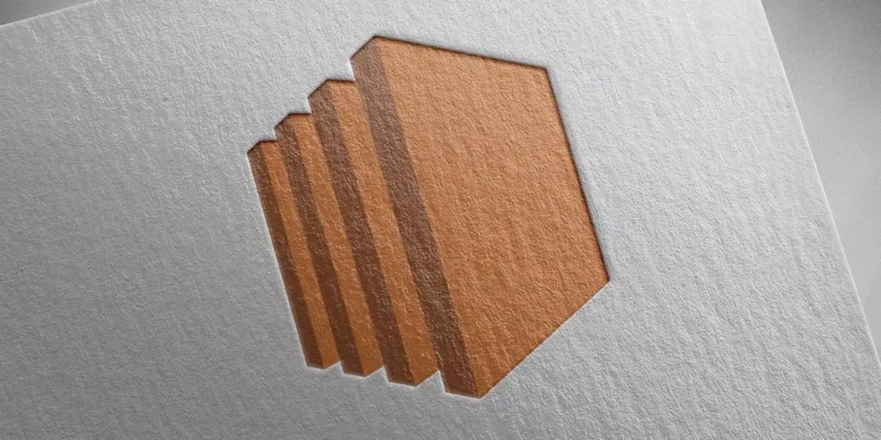 Embossed layered hexagonal shape pressed into textured paper