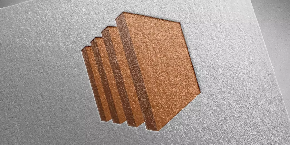 Embossed layered hexagonal shape pressed into textured paper