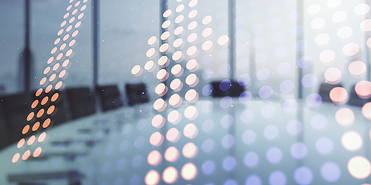 Blurred conference room table with abstract light dot overlay