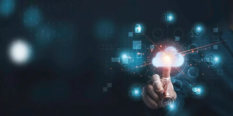 Hand pointing toward a glowing cloud icon surrounded by security and network icons