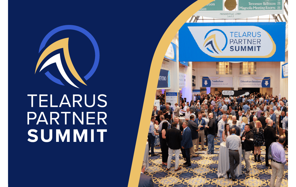 Telarus Partner Summit banner with attendees at the conference