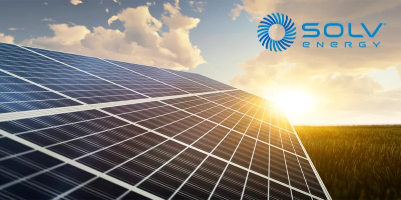 Solar panel array at sunset with SOLV Energy logo